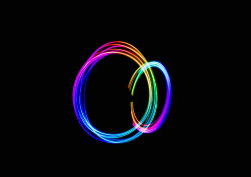 black wallpapers time-lapse photography of person doing circle rainbow light light
